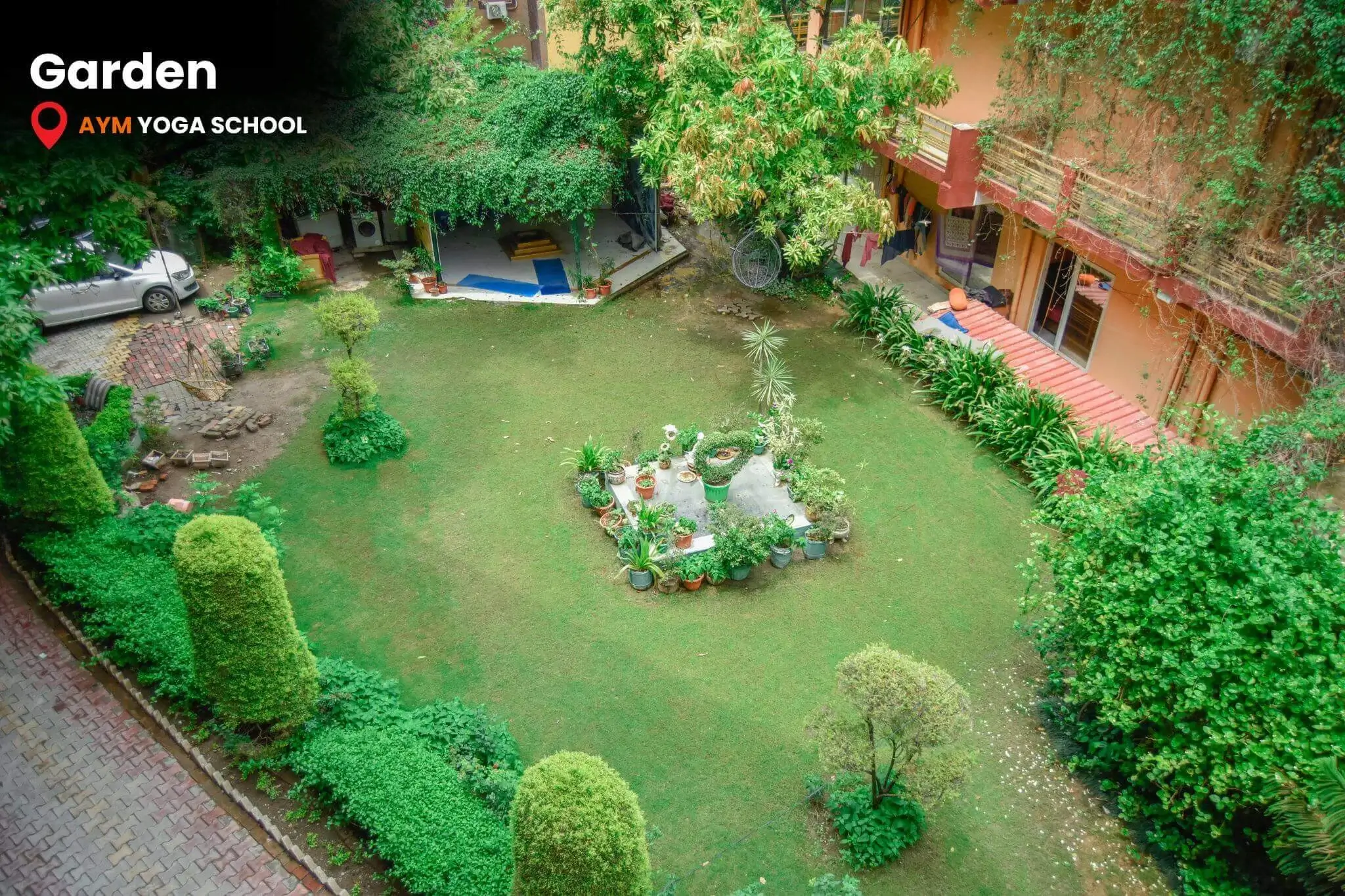 Peaceful garden at AYM Yoga School Rishikesh yoga campus
