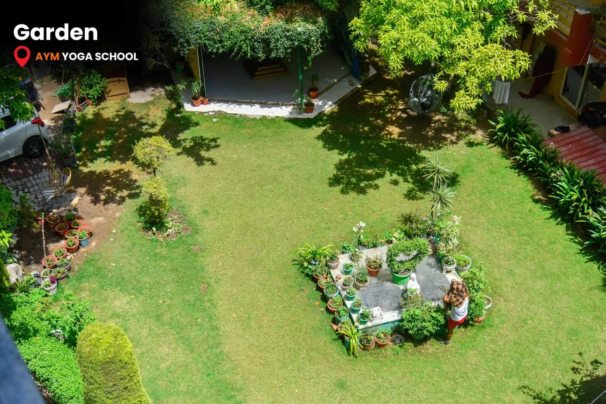 AYM Yoga School Rishikesh surrounded by garden greenery