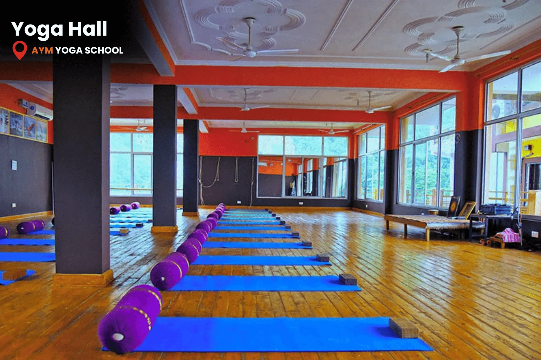 Spacious yoga hall with wooden flooring in Rishikesh
