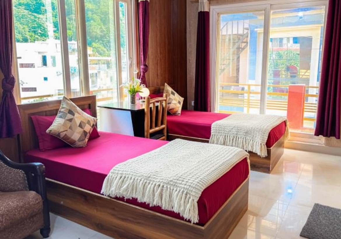 Shared student accommodation with twin beds and study desks