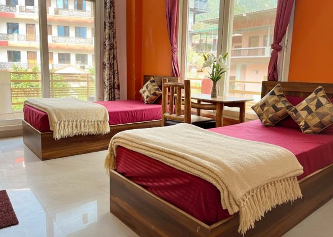 Neat and airy twin-sharing room for yoga course participants